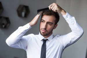 gay man with comb deposit photo