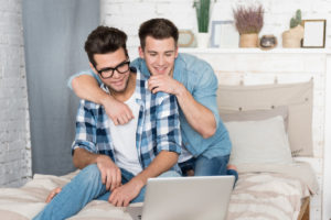 gay couple with laptop deposit photo 11 30 19