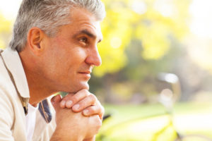 portrait of thoughtful middle aged man outdoors