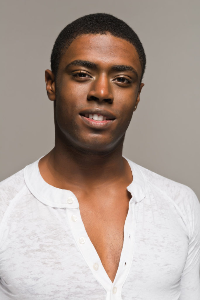handsome black man in white shirt deposit photo May 2020