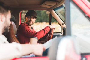 Men driving together.