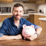 man holding piggy bank deposit photo 3 6 21