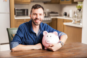 man holding piggy bank deposit photo 3 6 21