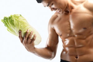 black male shirtless bodybuilder holding lettuce deposit photo 12 30 21