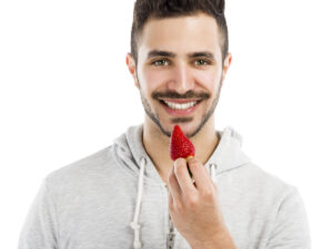 man tasting strawberry deposit photo 4 11 22