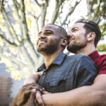 gay couple interracial embracing deposit photo 8 22 22