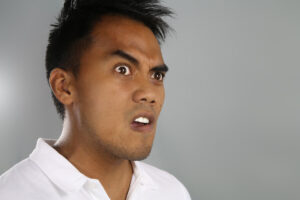 surprised angry young Asian man deposit photo 8 7 22