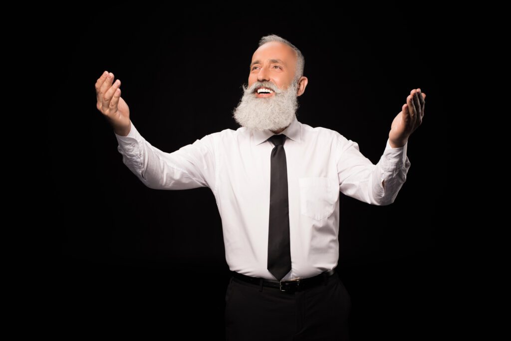 man with arms outstretched white shirt black tie white beard deposit photo May 2025