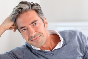 Handsome man relaxing in sofa at home