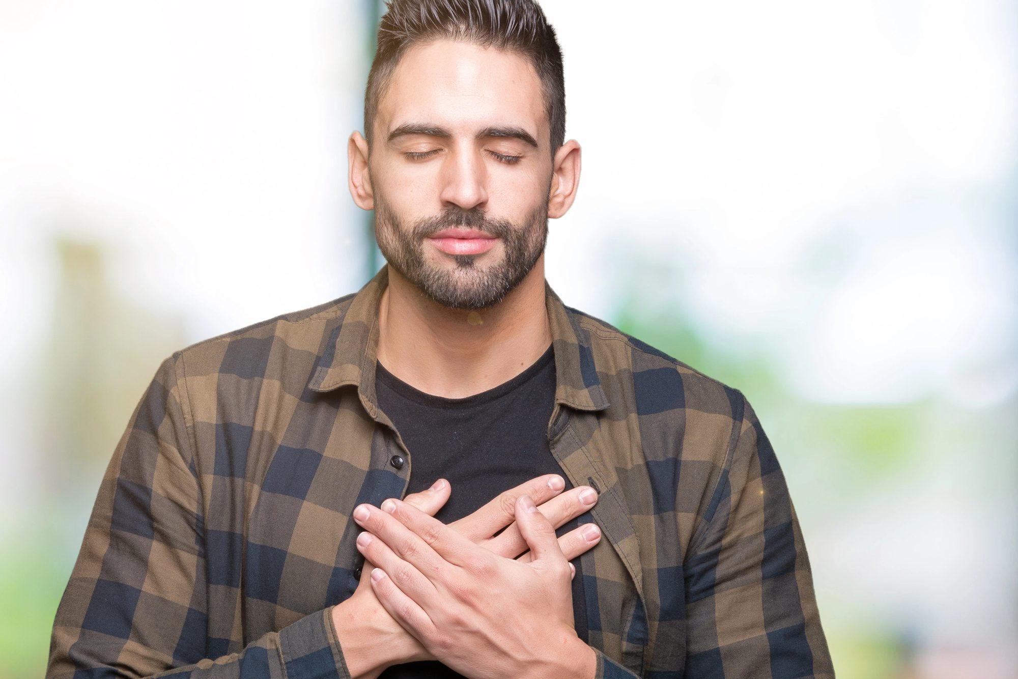 handsome-man-hands-on-chest-grateful