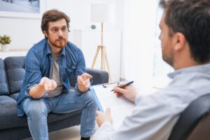 Therapist and client sitting in conversation
