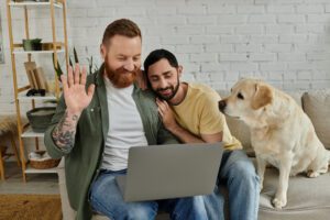 Gay male couple in online therapy session, representing telehealth relationship counseling in California