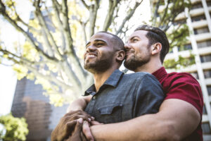 Gay male couple talking together during a date